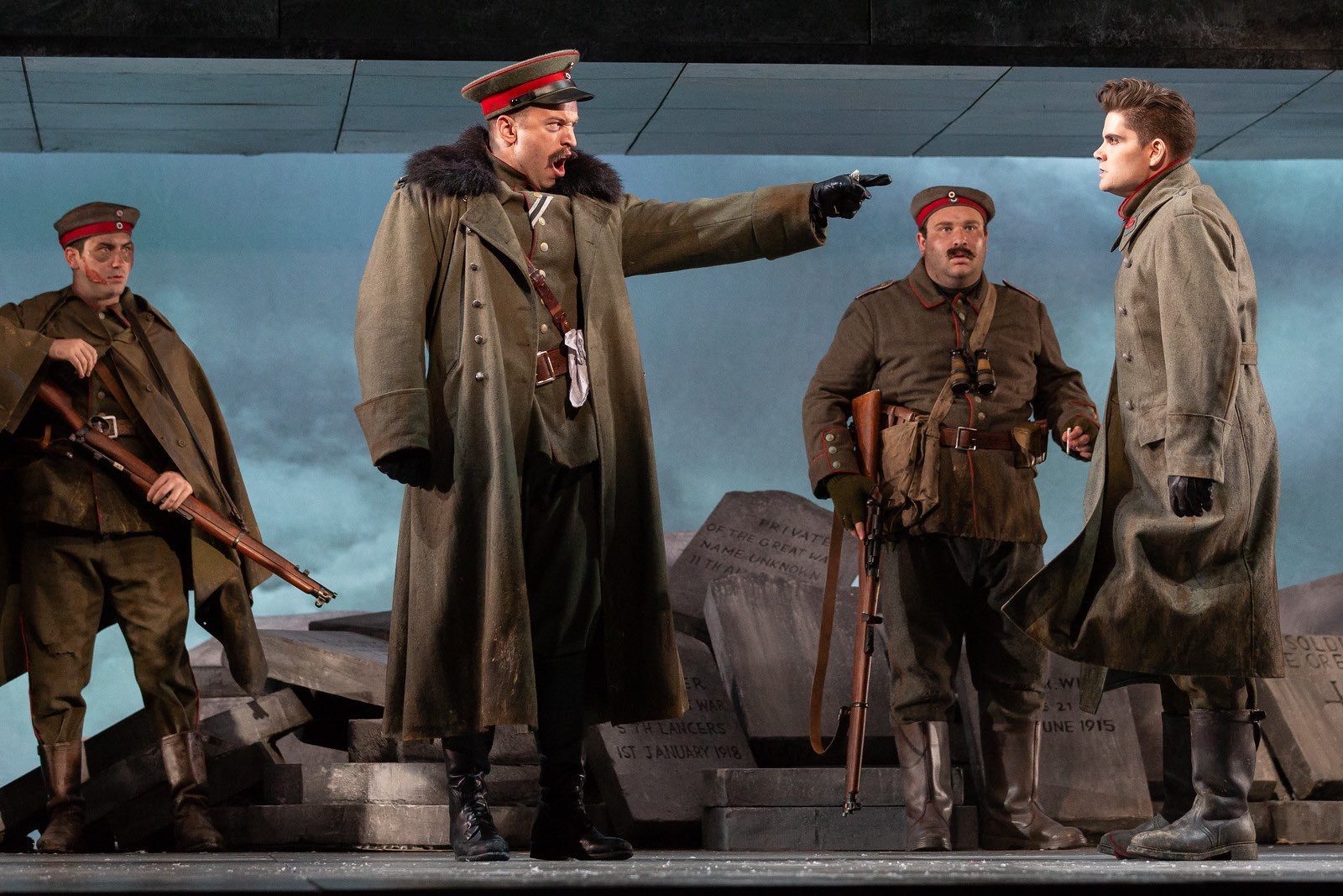 Michael Hewitt as a World War I officer, pointing as he sings, in Silent Night at the Glimmerglass Festival